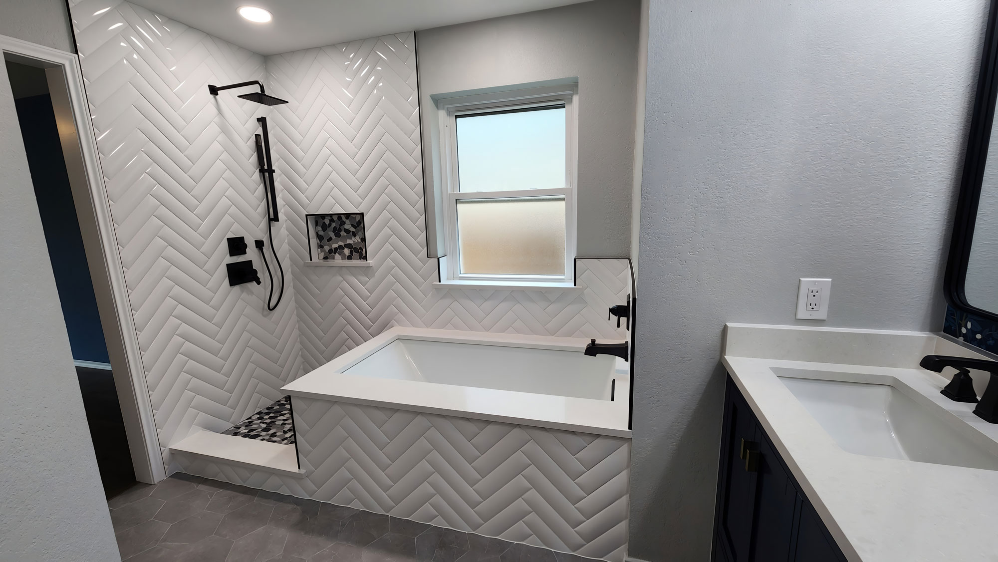 Herring bone master bathroom tile