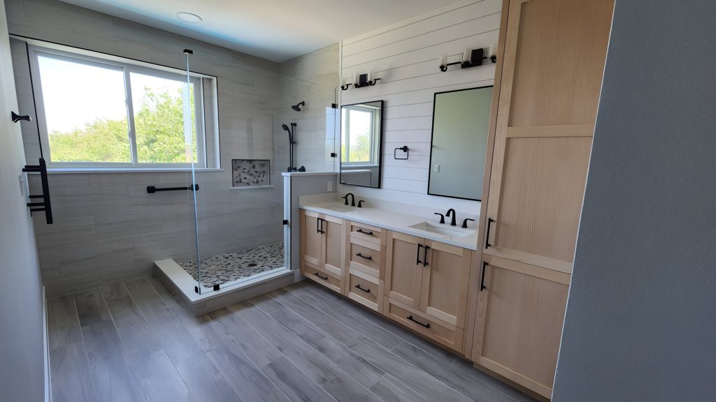 Bathroom remodeling in Point Venture, TX Custom master bathroom with clear maple cabinets and walk in shower