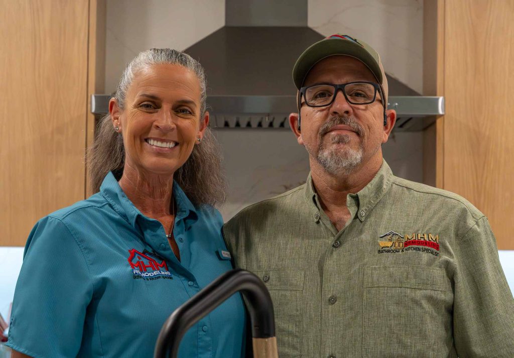 Michael and Cindy Stathos together in their remodeled Jonestown kitchen, featured on the MHM Remodeling About page.