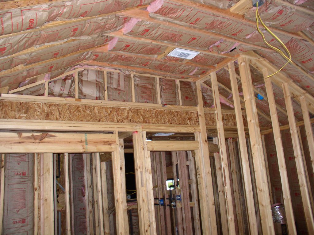 Master suite addition framing with new insulation and structural beams in Austin TX